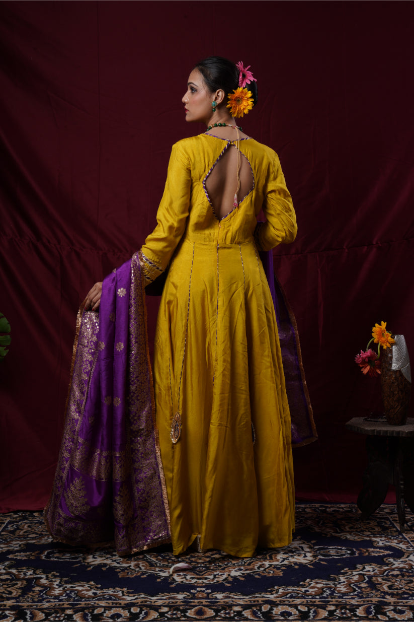 A mustard yellow anarkali gown