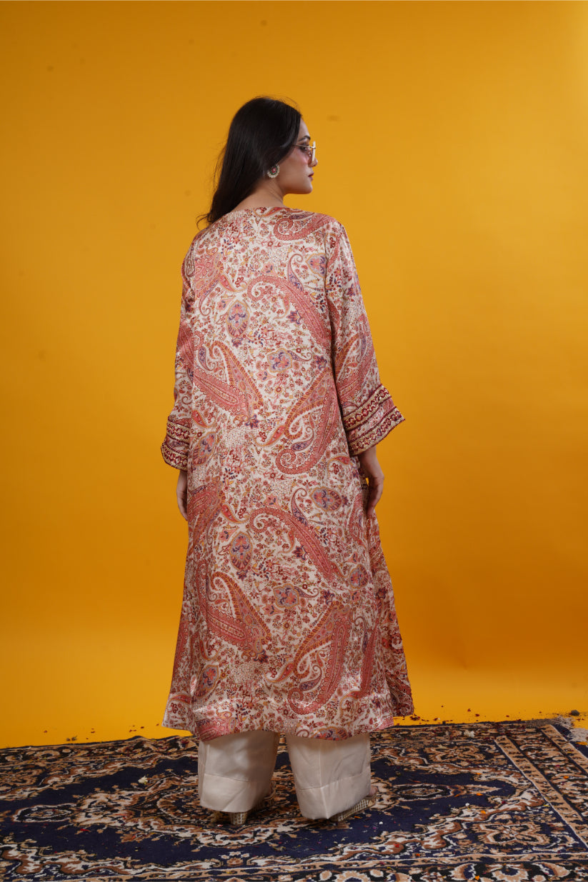 An ivory paisley print suit set with handwork