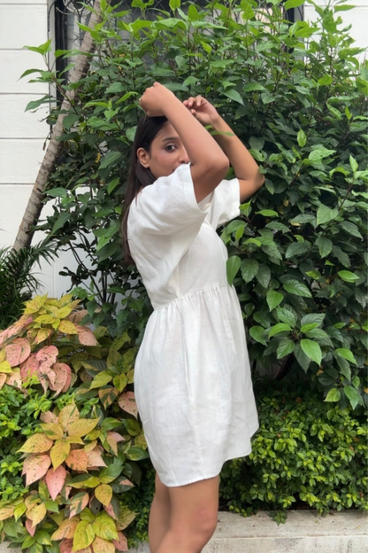 Side view of white hemp mini dress with V-neck