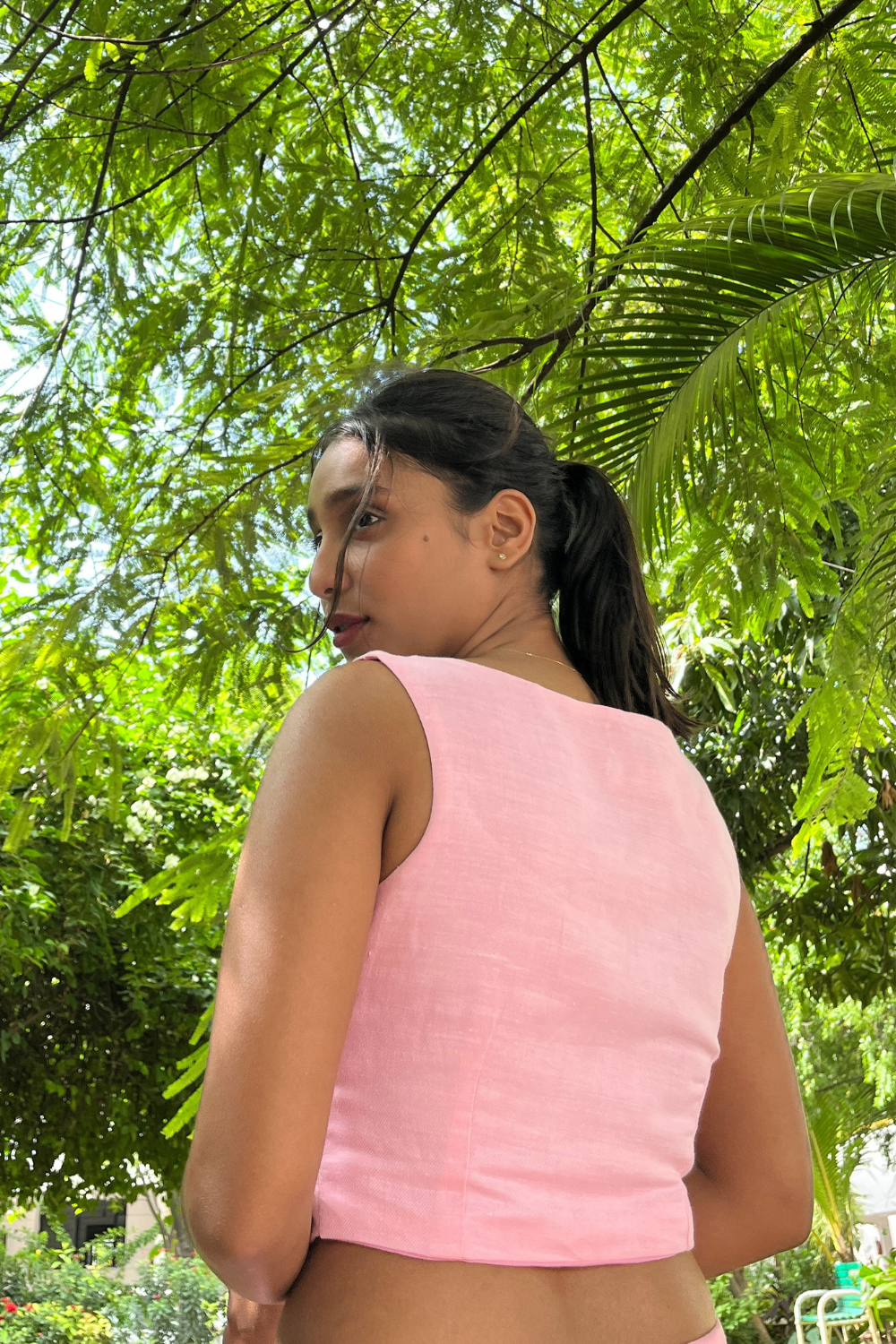 Pink Candy crop top with wooden buttons worn by model