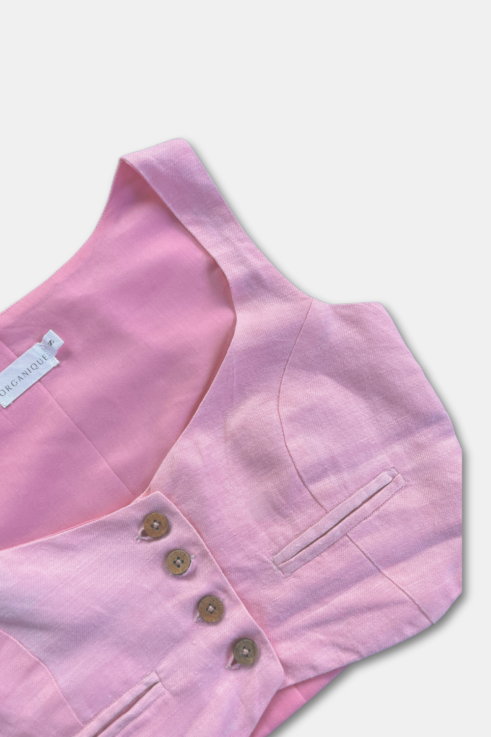 Pink Candy crop top with wooden buttons worn by model