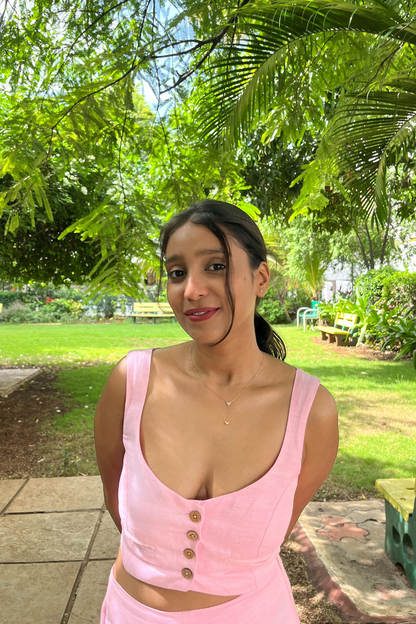 Pink Candy crop top with wooden buttons worn by model