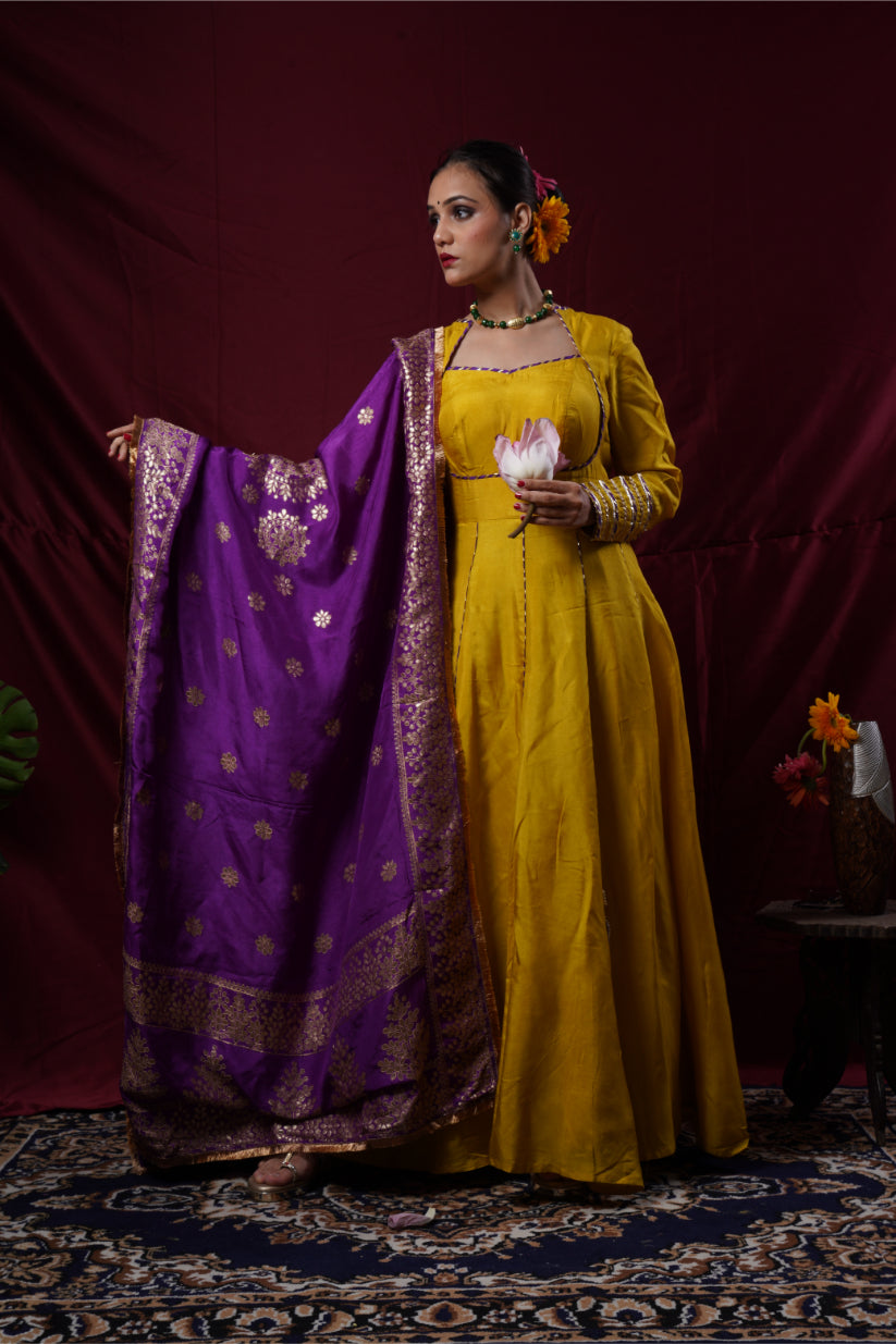 A mustard yellow anarkali gown