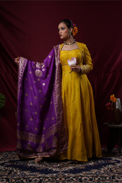 A mustard yellow anarkali gown