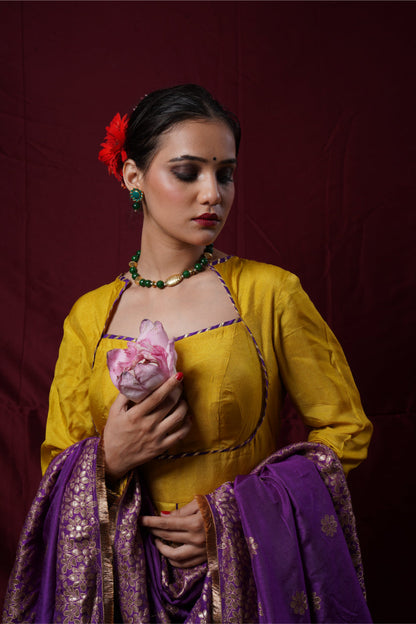 A mustard yellow anarkali gown