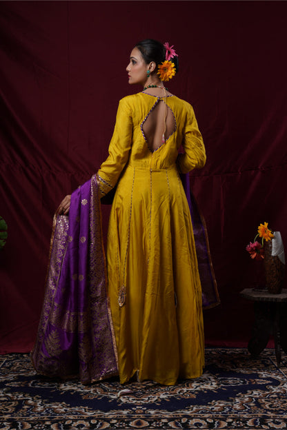 A mustard yellow anarkali gown