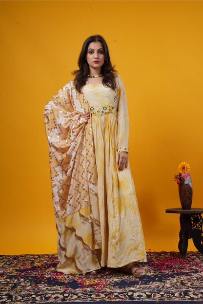 A mustard yellow tie-dye gown with a double yoke