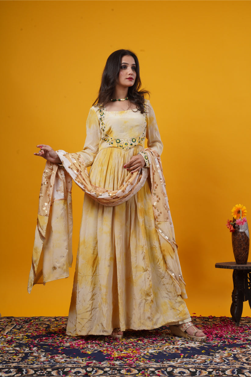 A mustard yellow tie-dye gown with a double yoke