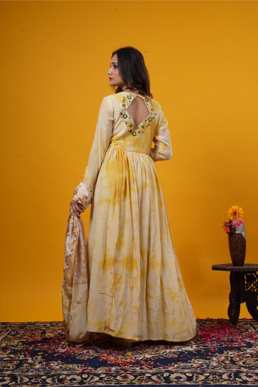 A mustard yellow tie-dye gown with a double yoke