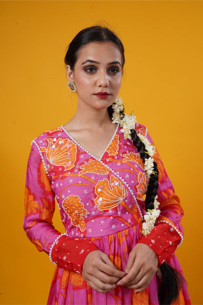 A pink floral gown with handwork