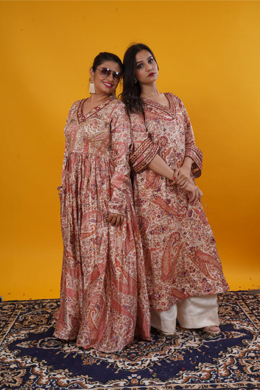 An ivory paisley print  suit set with handwork