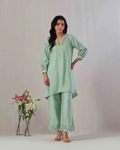 Sage green kurta and pant co-ord set featuring organza appliqué and embroidery on neckline, sleeve and pant.  100% Viscose Chanderi  Made in India