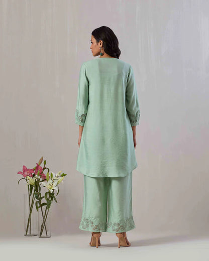 Sage green kurta and pant co-ord set featuring organza appliqué and embroidery on neckline, sleeve and pant.  100% Viscose Chanderi  Made in India