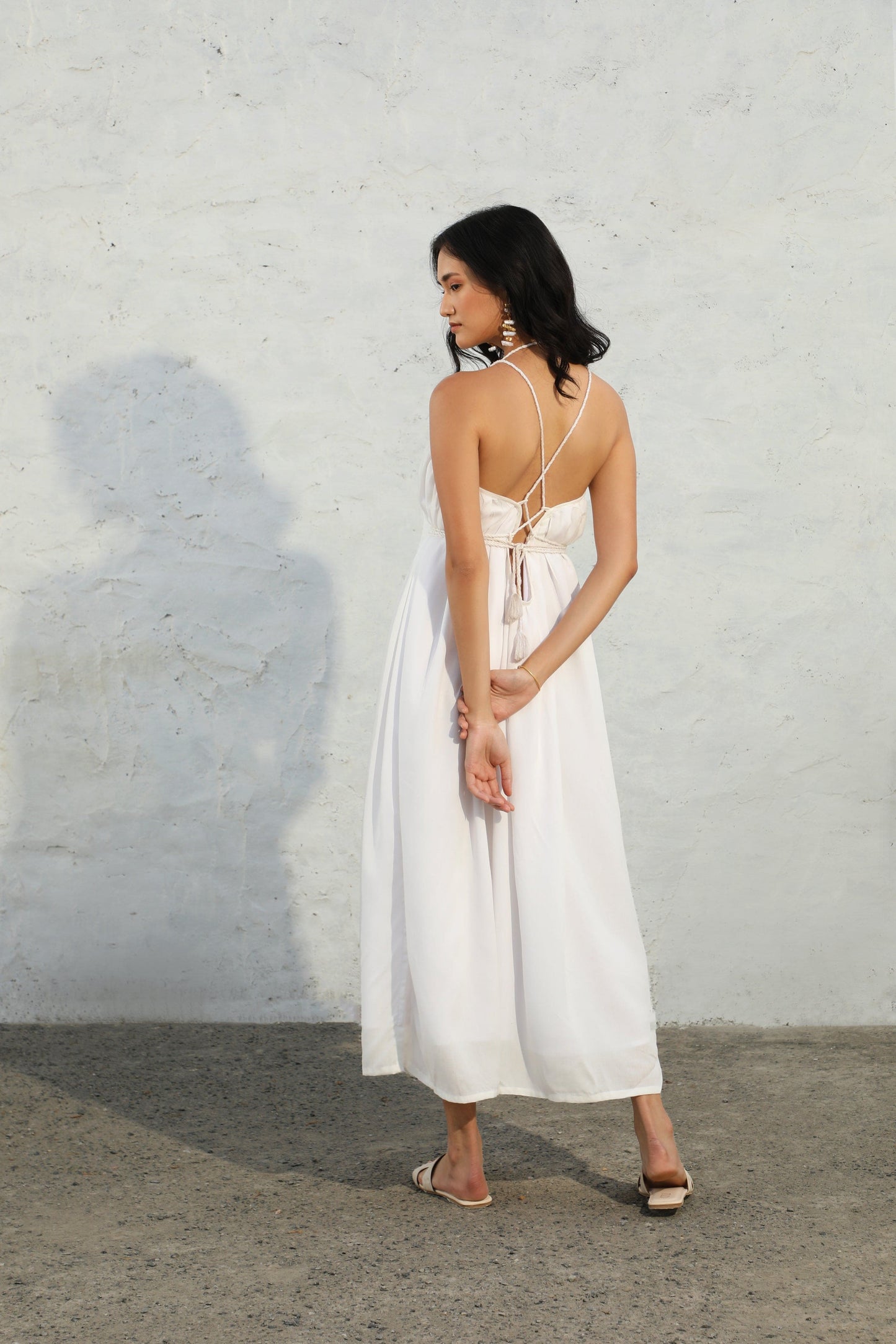 white reverie dress back pose 